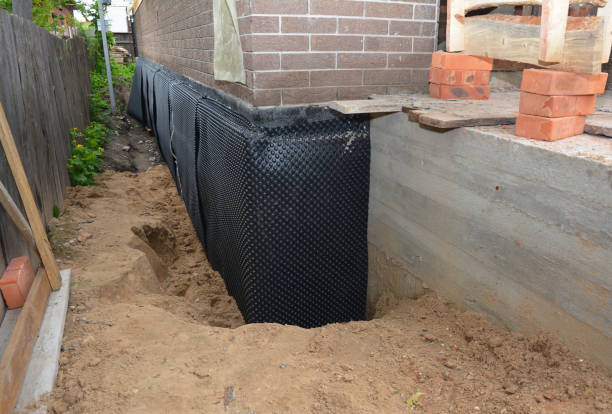 Happy homeowners after waterproofing job in Kellnersville